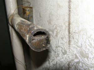 Lime deposits and rust reduce the inner diameter of the metal pipe by more than half