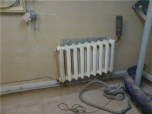 An example of installing a heating element in a cast-iron radiator